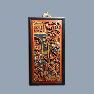 A Chinese lacquered and polychromed carved wooden panel, 19th C.